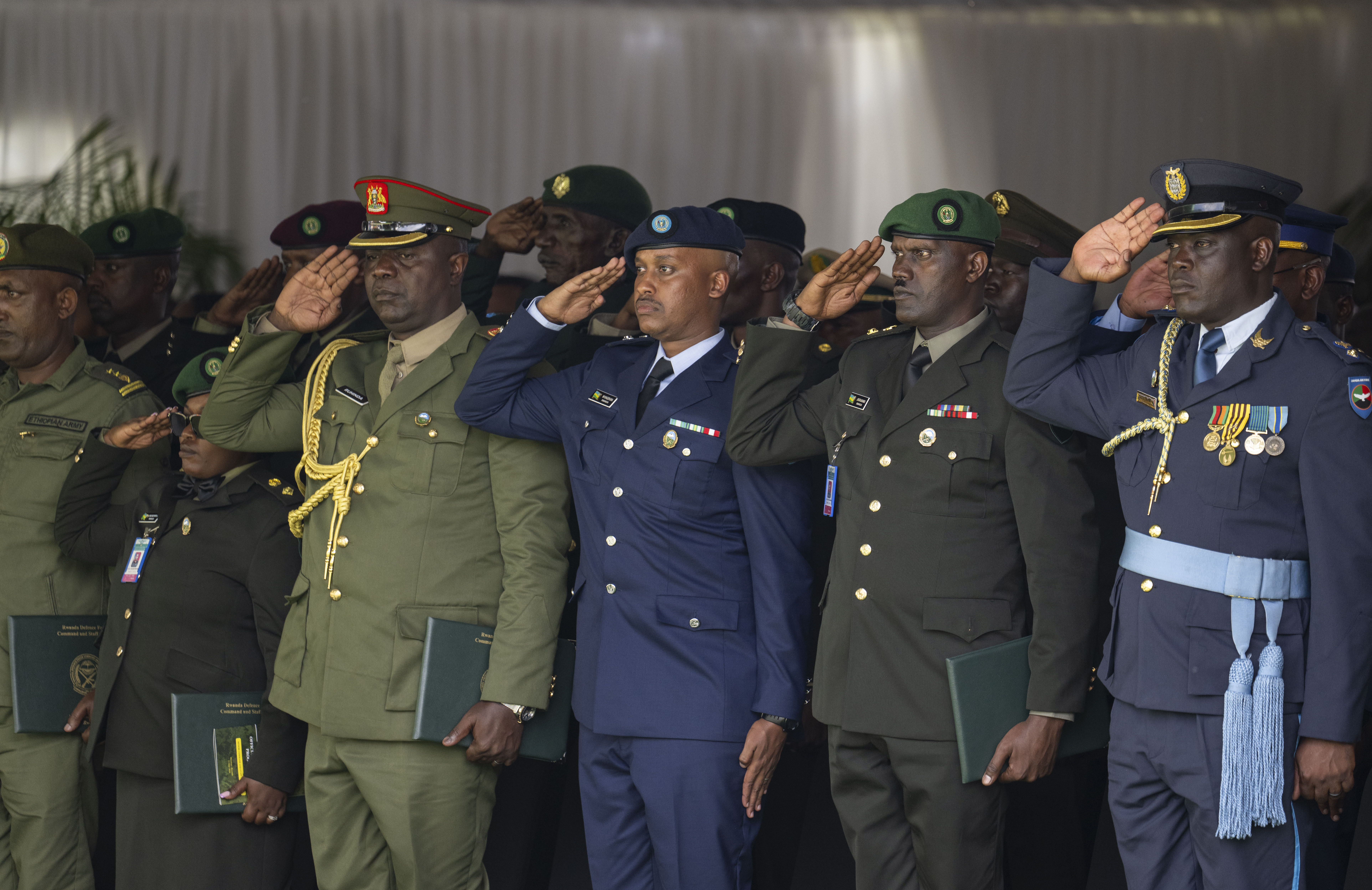 NDU-R officers saluting during a Senior Command and Staff Course ceremony